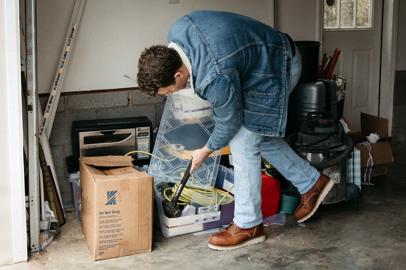 model wearing Carhartt Wedge Work Boots in garage