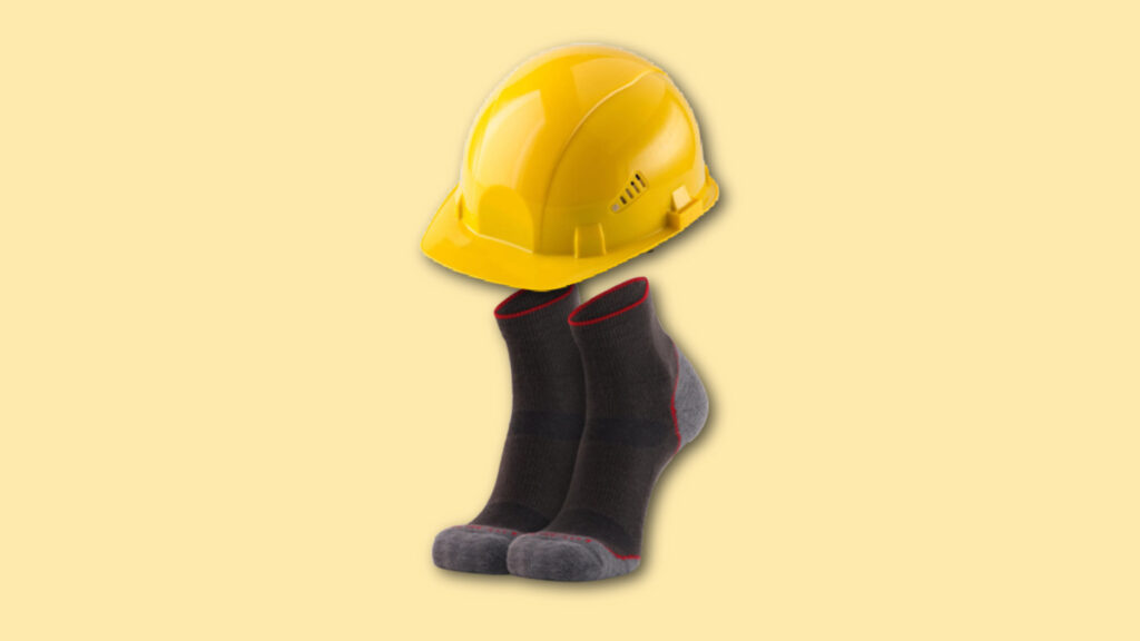 best socks for construction workers - darn tough work socks with a yellow helmet